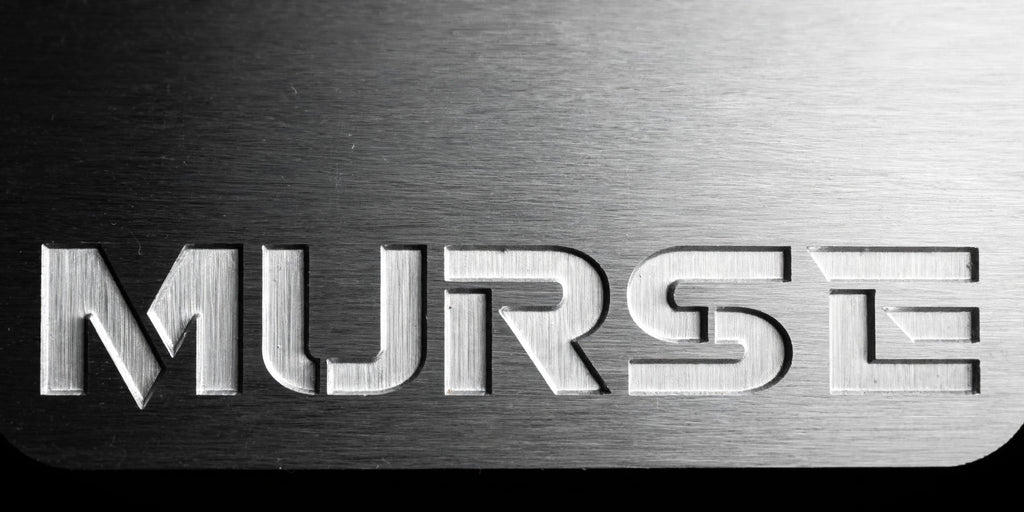 Murse Badge horizontal - extreme macro close-up of engraved MURSE lettering